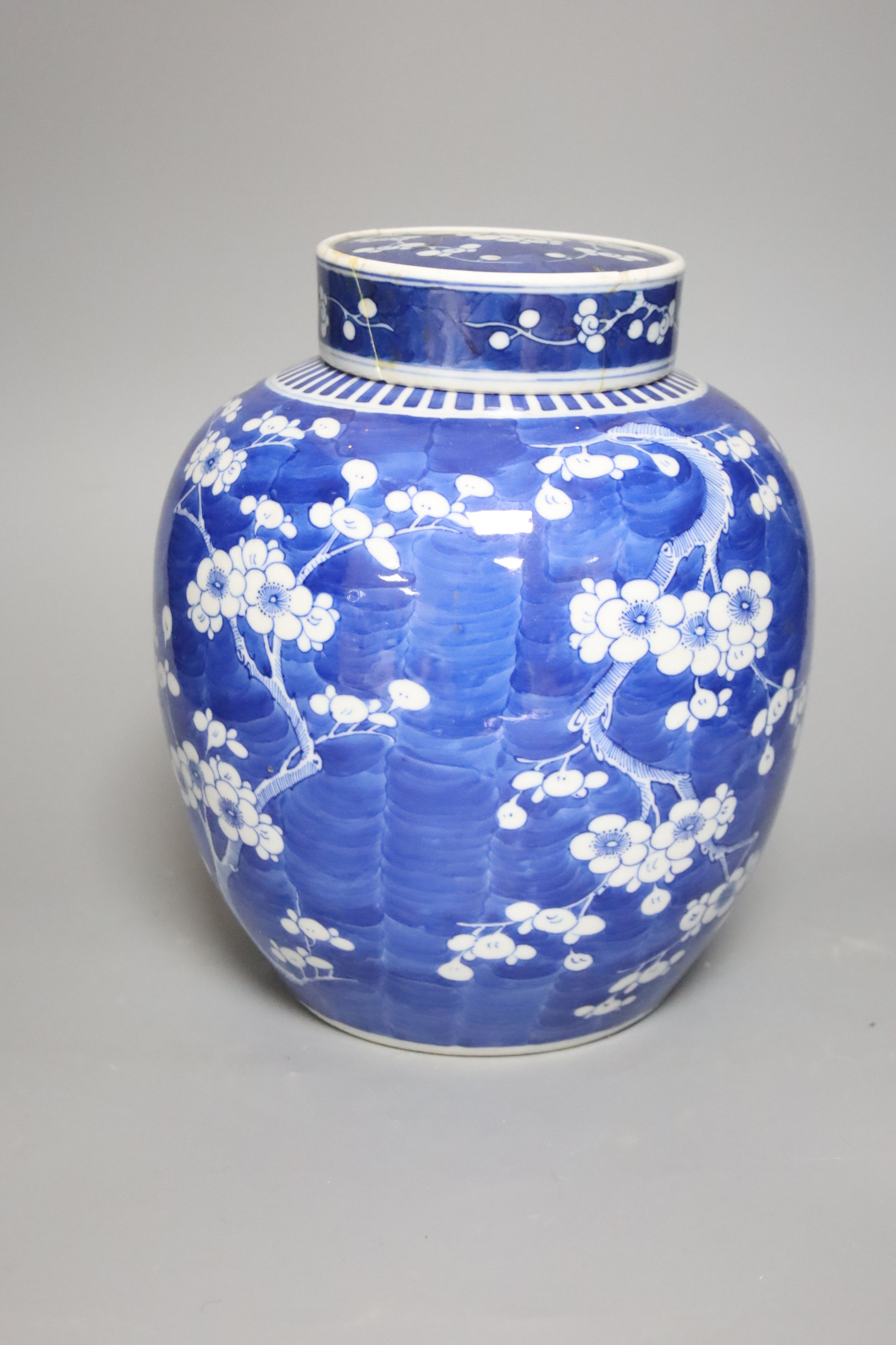 An early 20th century Chinese blue and white prunus jar and cover, height 26cm